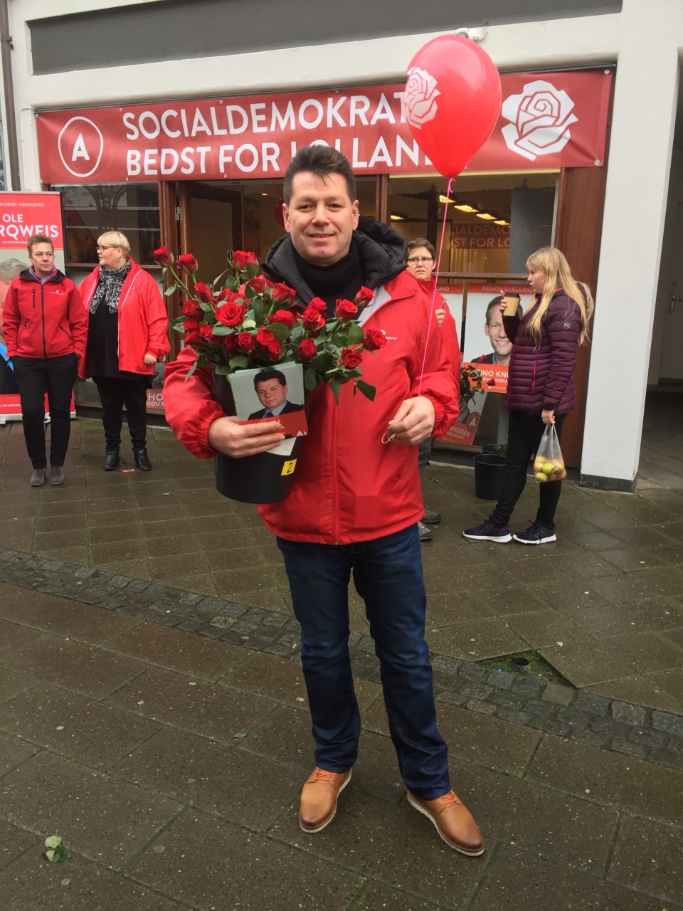 Man and a woman shaking hands while the man bows