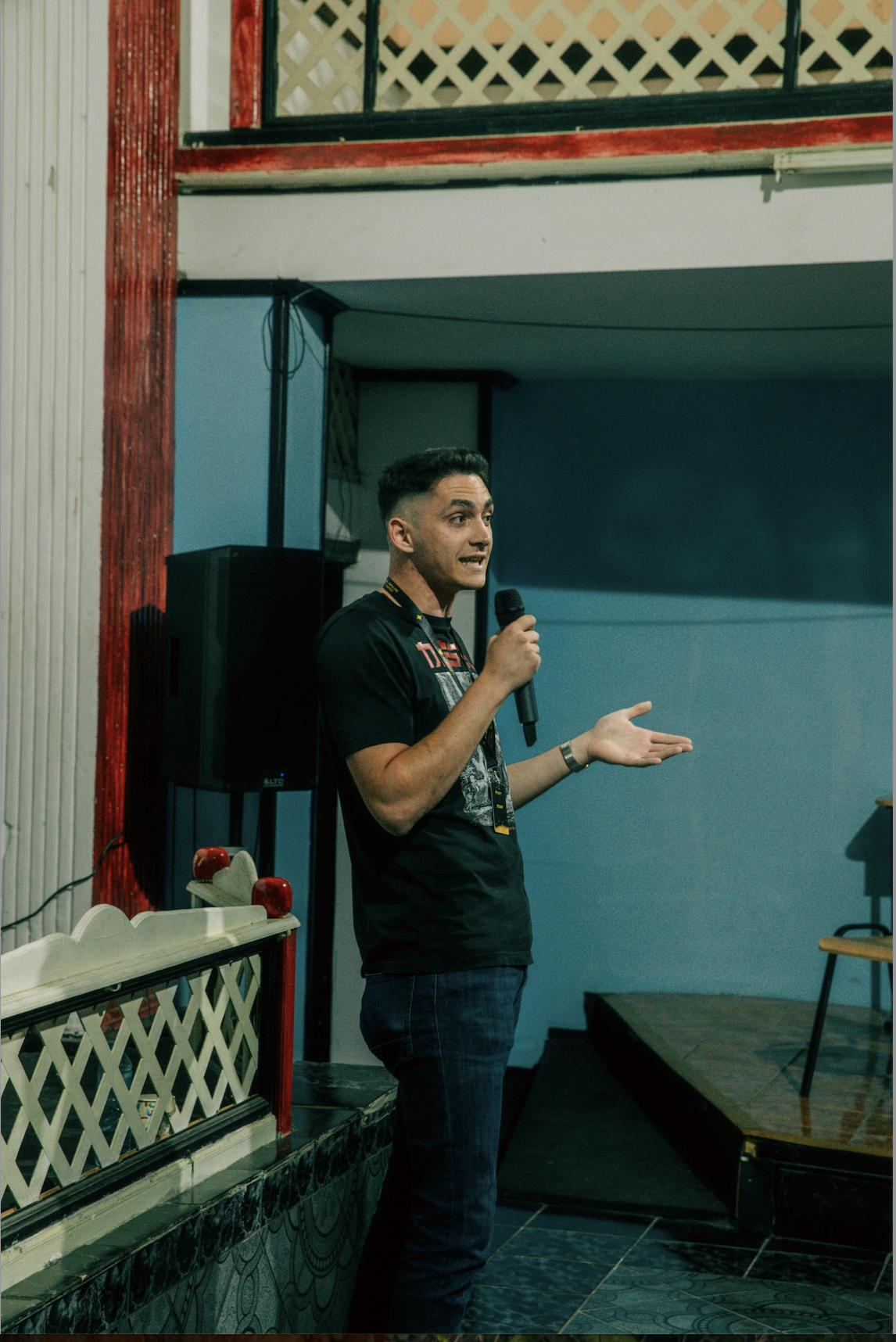 Man giving a speech on a microphone