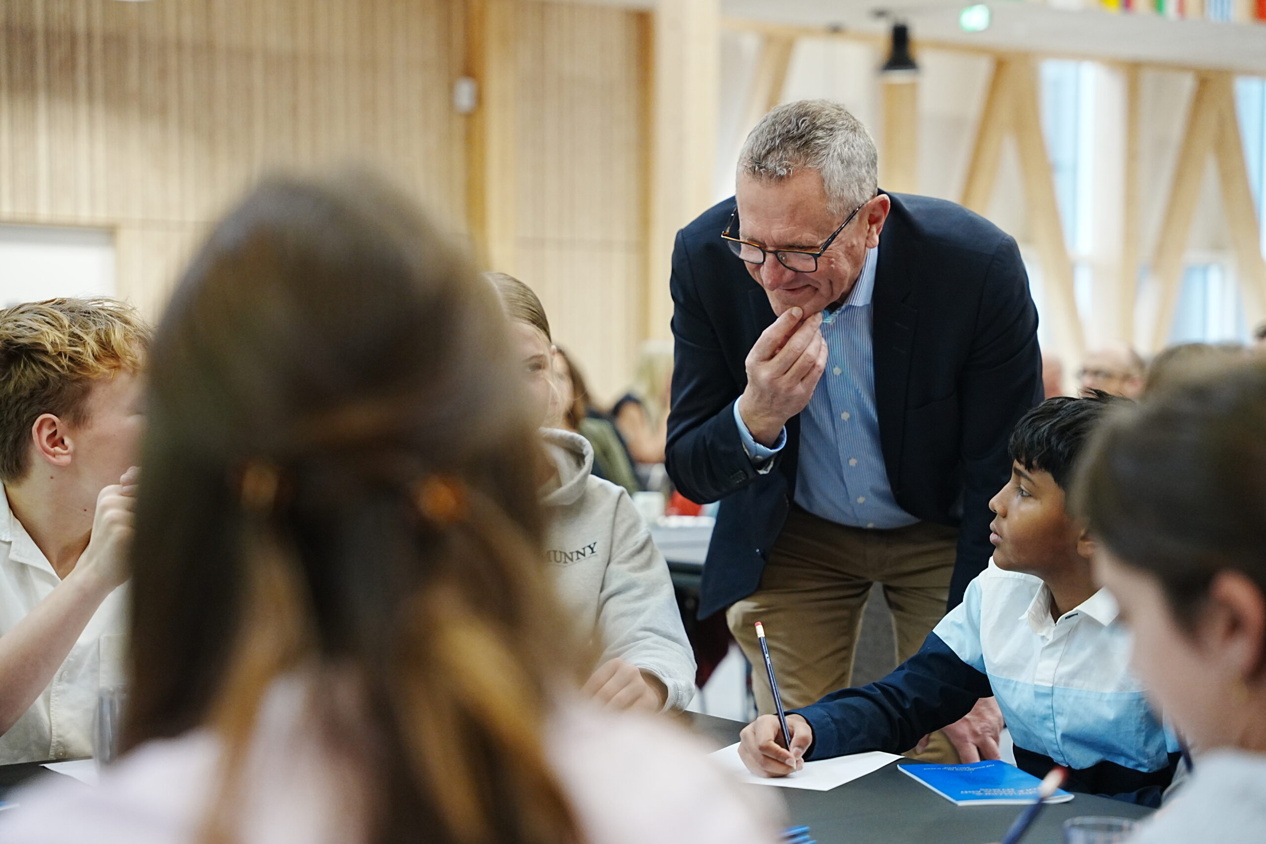 Man interacting with students