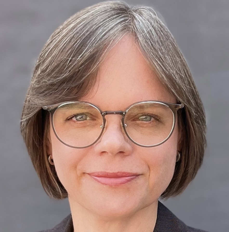 Julia Jones Portrait picture of a woman in glasses smiling