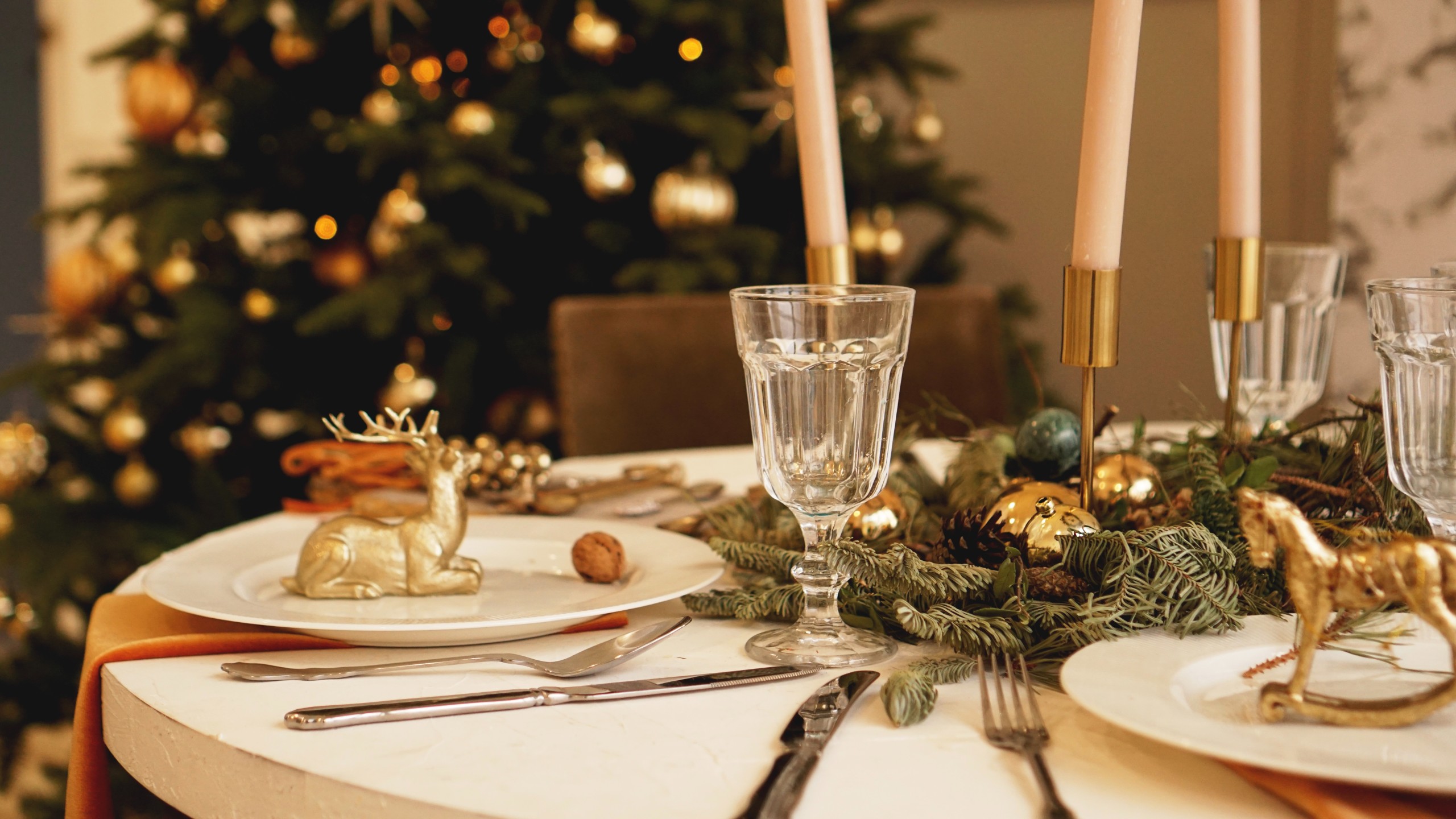 Table served for christmas dinner in living room close up