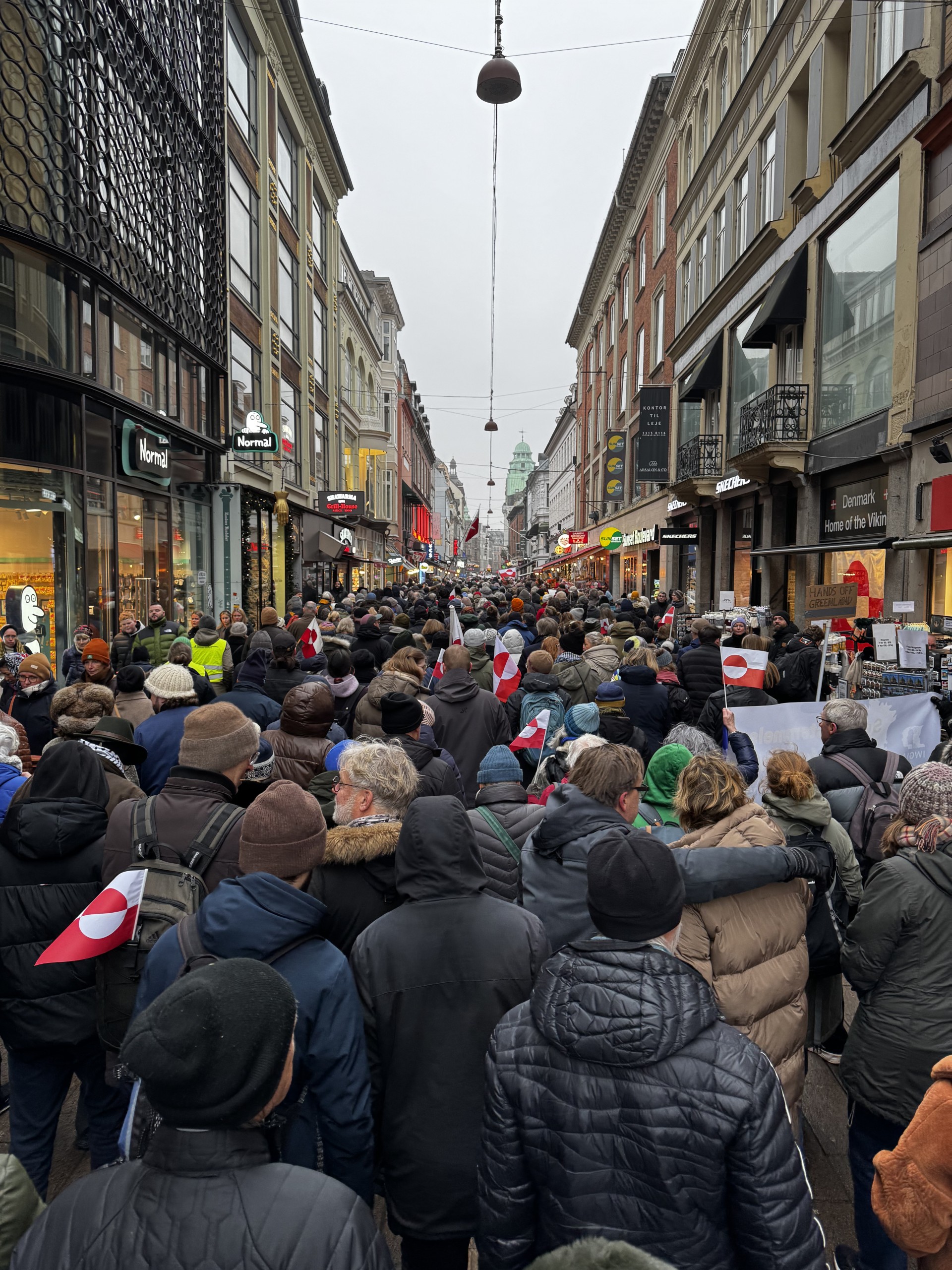 Crowd of people walking in a street as a protest