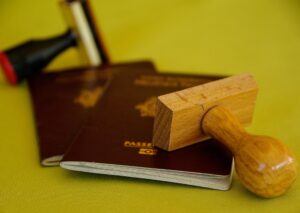 Featured image Passport Image of 2 red passports on a yellow background