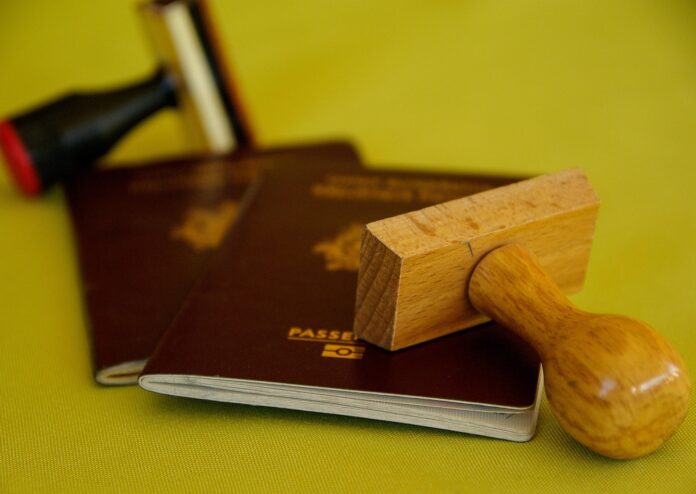 Featured image Passport Image of 2 red passports on a yellow background